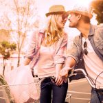 35925480 – hip young couple on a bike ride on a sunny day in the city