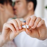 wedding rings lie on a toy carousel with little horses